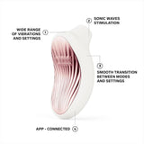 The LELO Sona 3 - Cream is a white and pink handheld device featuring labeled sonic wave stimulation, a wide range of vibration settings, smooth mode transitions, and convenient app connectivity. The LELO Sona 3 - Cream is a white and pink handheld device featuring labeled sonic wave stimulation, a wide range of vibration settings, smooth mode transitions, and convenient app connectivity.