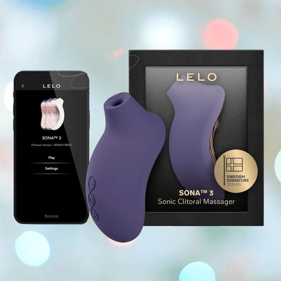 A LELO Sona 3 - Cyber Purple clitoral massager is shown beside its black and gold packaging and a smartphone displaying the LELO app controls. A LELO Sona 3 - Cyber Purple clitoral massager is shown beside its black and gold packaging and a smartphone displaying the LELO app controls.