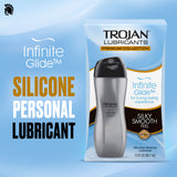 The box and bottle of Trojan Infinite Glide - Premium Silicone-Based Personal Lubricant (3oz) by Trojan are displayed on a light blue background. Text highlights “Silicone-Based Personal Lubricant” and features such as “Silky Smooth Feel.” This premium lubricant provides a long-lasting experience designed for ultimate comfort.