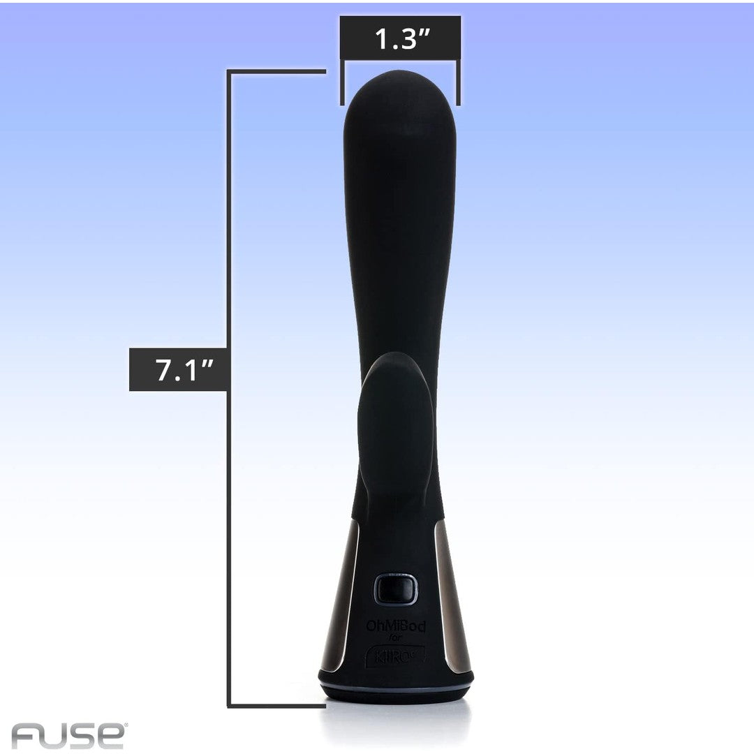 The OhMiBod Fuse Interactive Dual Stimulator in black is a sleek personal electronic device, measuring 7.1 inches in length and 1.3 inches in width, set against a gradient blue background. Its Bluetooth-enabled design showcases smooth, curved lines with a central button and the "OhMiBod" brand name elegantly placed at its base, blending technology with chic sophistication.