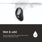 A black We-Vibe Bond App Controlled Vibrating Cock Ring, partially submerged in water with splashes, against a white background. Text below reads: "Wet & wild. We-Vibe Bond is waterproof (IPX7), making it easy to enjoy anywhere and simple to clean," accompanied by a check mark icon.