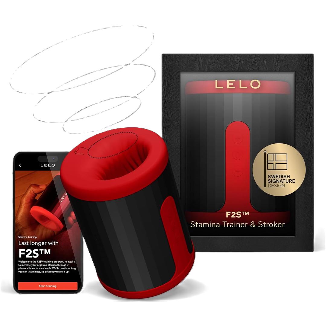 The LELO F2S Massager & Stroker Red by LELO is displayed beside its black and red box, with a smartphone nearby showing its app-controlled features and product details on the screen.