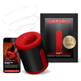 The LELO F2S Massager & Stroker Red by LELO is displayed beside its black and red box, with a smartphone nearby showing its app-controlled features and product details on the screen.