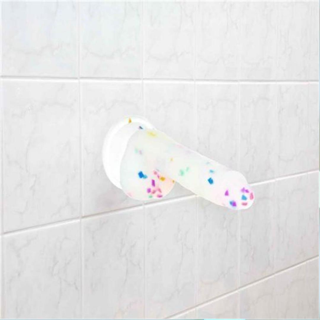 The BMS Addiction Party Marty Vibrating Dildo - Rainbow 7.5" brings playful vibes and colorful style to your space with its fun design and vibrant rainbow confetti details.