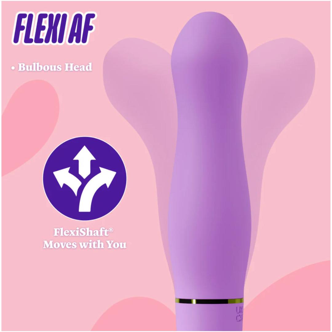 The Aria Rechargeable Vibe Exciting AF-Indigo by Blush Novelties features a flexible, bulbous head and a waterproof, body-safe silicone shaft that moves in multiple directions. It stands out against a pink backdrop with abstract shapes.