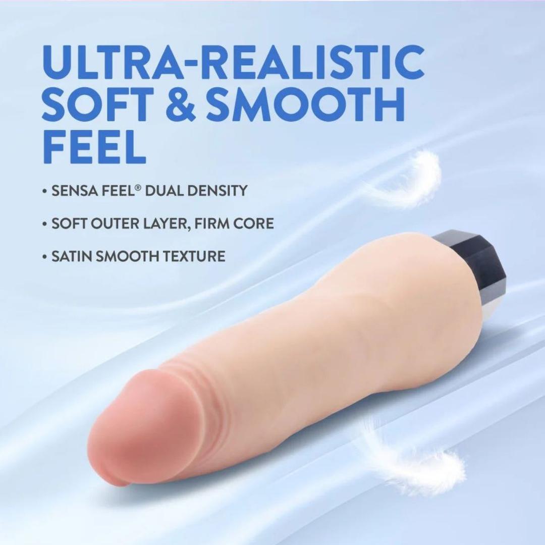 The Au Naturel Vanilla Ice Vibrating Dildo by Blush Novelties, featuring dual density and a satin smooth, ultra-realistic flesh-toned finish, is displayed against a blue background. Text highlights its lifelike feel and texture.
