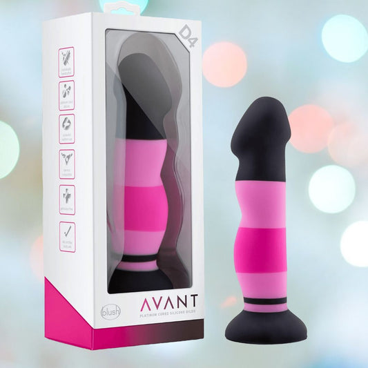 A package displays the Avant D4 7" Sexy in Pink Silicone Dildo. Next to the box is the 7-inch dildo featuring a color scheme of black, dark pink, and light pink stripes with a deep suction cup base. The background showcases a soft focus of colorful lights. 1080