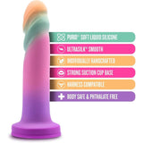 The Avant Sunrise Gaze - Sherbet Realistic Dildo, by Avant, is presented with a vibrant display of text boxes highlighting its features: crafted from soft platinum-cured silicone, designed with an ultrasmooth Ultrasilk texture, individually handcrafted as an artisanal dildo, harness compatible for versatile use, body-safe to ensure user comfort and safety, and phthalate-free for added peace of mind. It also includes a strong suction cup base in multicolor.