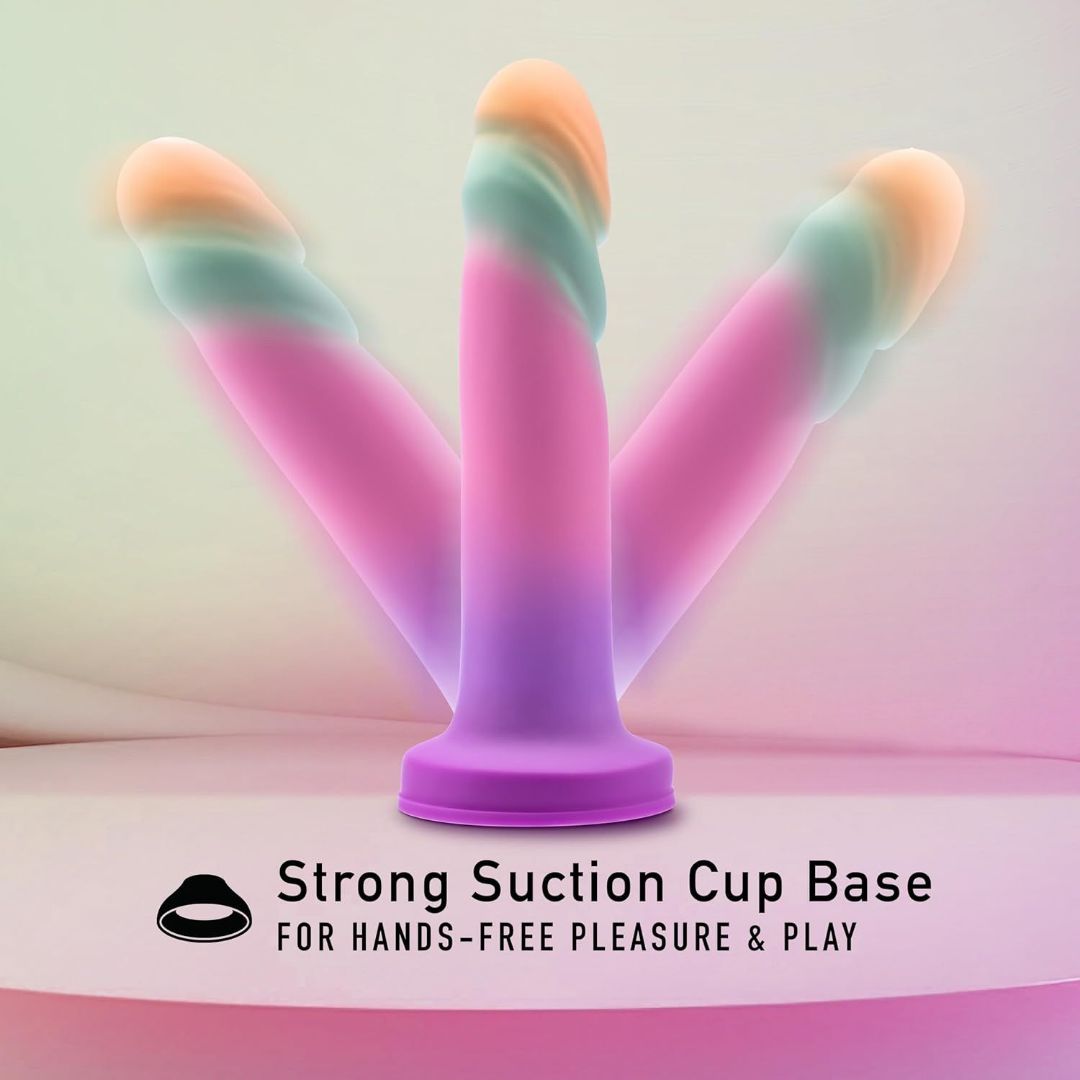 On a gentle, pastel backdrop, the Avant Sunrise Gaze - Sherbet Realistic Dildo by Avant is displayed, featuring three vivid designs with spiral textures and a sturdy suction cup base. The text at the bottom states, "Strong Suction Cup Base for Hands-Free Pleasure & Play.