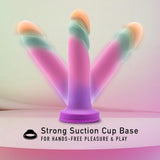 On a gentle, pastel backdrop, the Avant Sunrise Gaze - Sherbet Realistic Dildo by Avant is displayed, featuring three vivid designs with spiral textures and a sturdy suction cup base. The text at the bottom states, "Strong Suction Cup Base for Hands-Free Pleasure & Play.