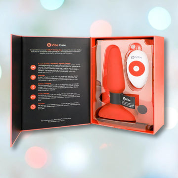 B-Vibe Rimming Plug 2 Vibrating Butt Plug - Orange Remote  Condomania.com