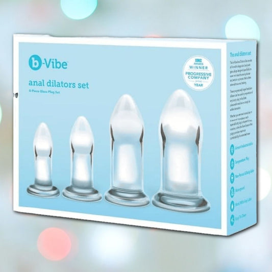 The B-Vibe Glass Anal Dilators Set of 4 includes body-safe clear glass plugs, offered in varying sizes and encased in elegant blue packaging. 1080