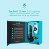 An open black box displays B-Vibe Triplet Beads Vibrating Anal Beads and a wireless remote. The one-touch remote works up to 30 feet. Made of body-safe silicone, this B-Vibe toy enhances couples' experiences.