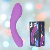 The BMS The Mini Swan Wand Glow in the Dark-Purple, a curved and compact vibrator, floats near its branded packaging with matching imagery and vibrant abstract designs, set against a softly blurred pastel background.