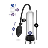 An image of the Blush Novelties Performance VX101 Enhancement Penis Pump shows a transparent cylindrical vacuum device with a black squeezable bulb connected via hose. The cylinder stands 9 inches tall, featuring an 8.5-inch insertable length, a 2.5-inch base diameter, and a 2.1-inch insertable diameter. Text indicates ring sizes for the included Stay Hard Cock Ring.

