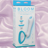 The Bloom Rechargeable Intimate Body Pump - Blue by Doc Johnson is shown in its box against a silky pink background, with packaging highlighting automatic vibration and interchangeable parts for versatile clitoral suction play.