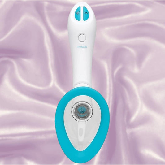 The Doc Johnson Bloom Rechargeable Intimate Body Pump - Blue features a white handheld design with blue accents, two buttons, and an oval-shaped opening. It rests on shiny lavender fabric. 1080