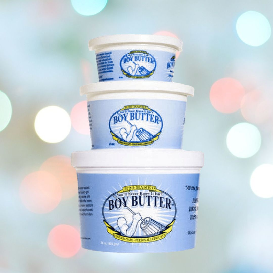 Three stacked containers of Boy Butter "H2O" Water-Based Lubricant, offered by Boy Butter and crafted with natural ingredients, are displayed against a blurred, vibrant backdrop with circular light spots, highlighted by their distinctive light blue design.