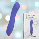 A CalExotics Connect Contoured "G" personal massager, featuring a purple design with a curved tip, is displayed alongside its packaging. The box showcases the CalExotics brand name and product details against a softly blurred background with colorful lights.