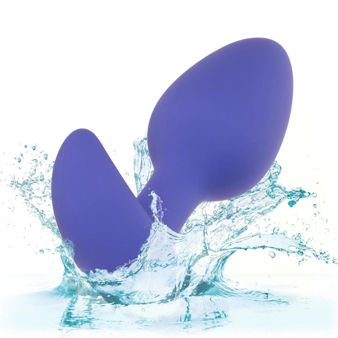 The CalExotics Connect Tapered Probe App Controlled Anal Vibrator by CalExotics splashes into clear blue water, surrounded by droplets and waves, with a white background.