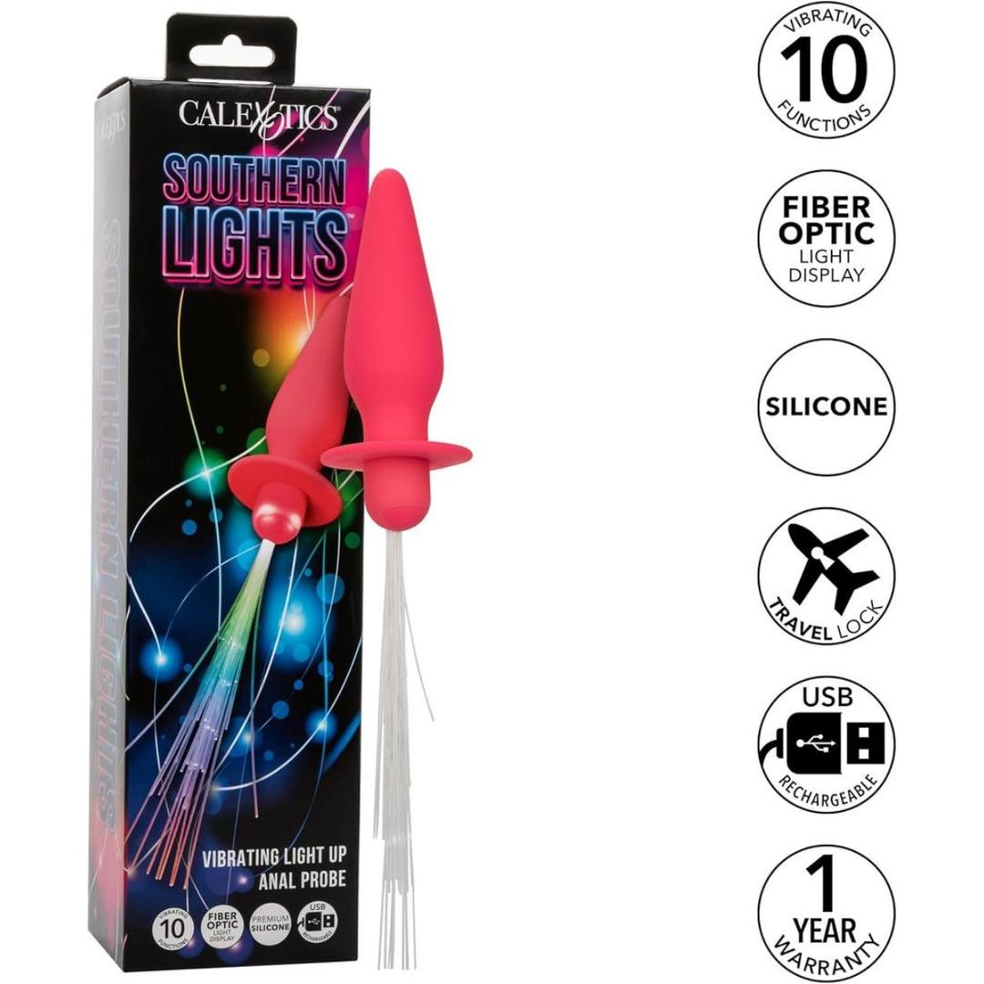 The CalExotics Southern Lights Vibrating Light Up Butt Plug Anal Vibrator Probe in pink is shown with its packaging. Features include 10 vibration functions, rechargeable silicone, travel lock, USB charging, and a 1-year warranty.