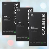 Three black boxes of Caliber 2XL - Extra Large Condoms (64mm Wide) by Caliber are displayed against a soft pastel background. Each box prominently features “2XL,” “12 latex condoms,” and sizing details along the bottom, underscoring the importance of finding the right condom size for a comfortable, custom fit.
