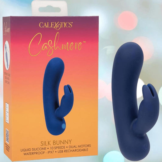 The CalExotics Cashmere Silk Bunny Rabbit Vibrator, a blue silicone dual-motor toy with 10 speeds, is shown beside its orange and pink box; it’s waterproof and USB rechargeable. 1080