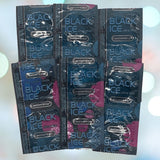 The image showcases several packets of "Caution Wear Black Ice Condoms," known for providing extra sensitivity. They are orderly arranged in a grid pattern against a gently blurred background.