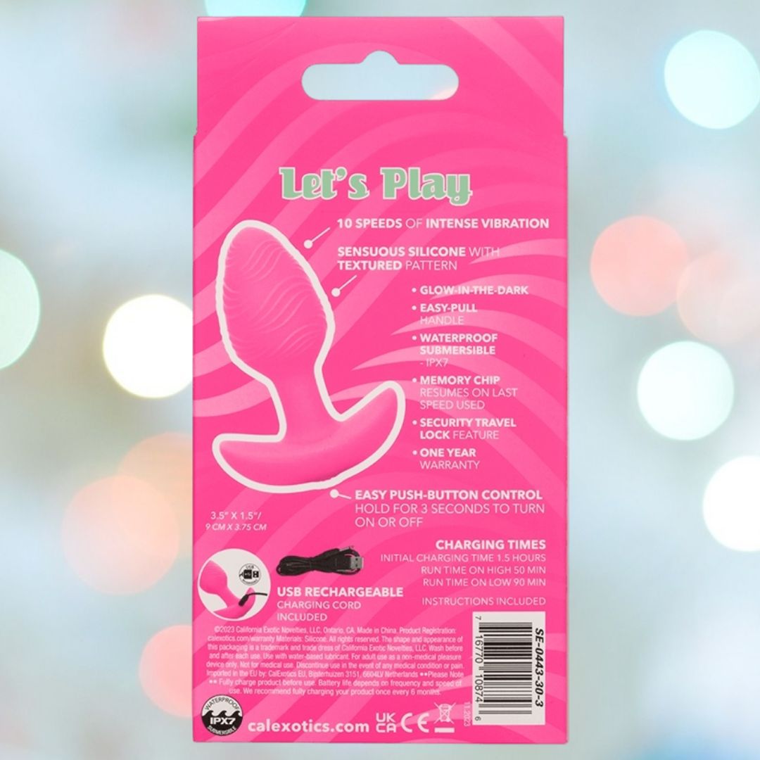 The image displays the rear of a pink box featuring the Cheeky Vibrating Glow-In-The-Dark Butt Plug by CalExotics. Made from body-safe silicone and labeled "Let's Play," this toy offers 10 vibration speeds, is waterproof, rechargeable, and includes a remote control. Safety information and warranty details are provided on the packaging.