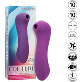 The CalExotics Couture Collection Dual Pleasure Wand is displayed next to its packaging, with icons showing 10 vibration modes, 10 suction settings, silicone build, dual motors, waterproof design, USB charging, and a 1-year warranty.