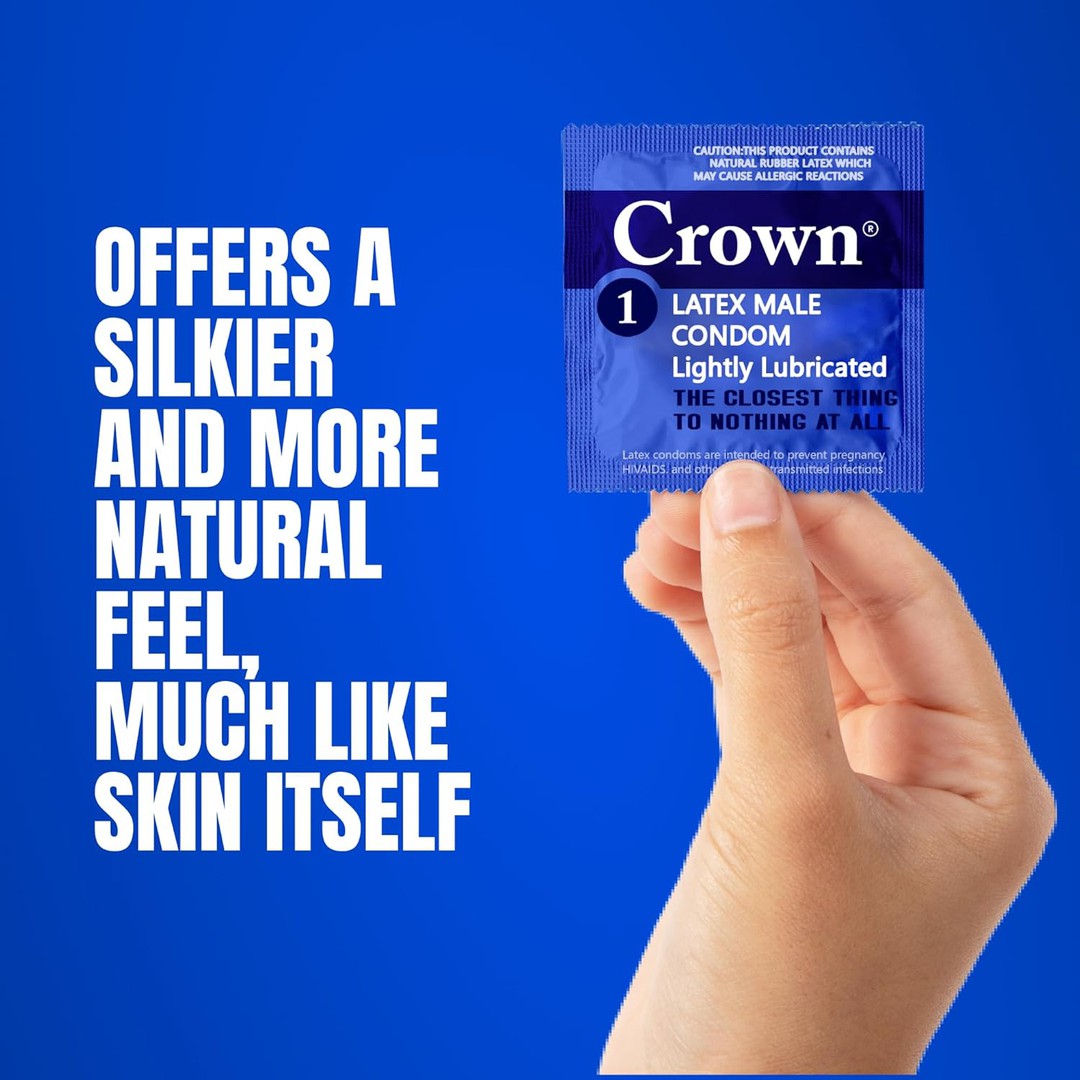 A hand holds a blue package of Crown Skinless Skin Ultra-Thin Condoms, renowned for their Japanese latex. The text on the left states, "Offers a silkier and more natural feel, much like skin itself." The background is a solid blue color.