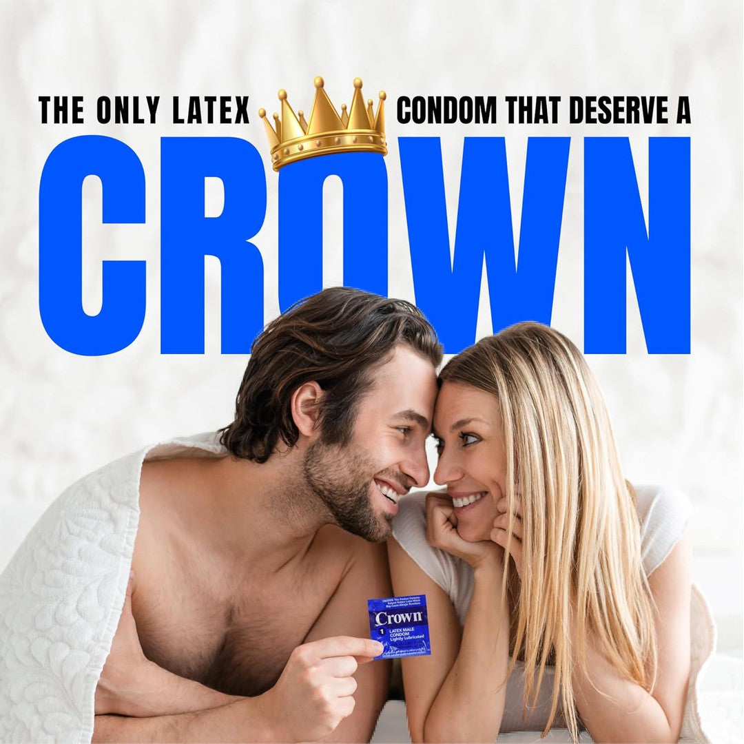 A couple under a white blanket smiles at each other. The man holds a pack of Crown Skinless Skin Ultra-Thin Condoms. Large blue text reads, "The only latex condom that deserves a crown," with a gold crown graphic above the word "Crown." Experience the natural sensation of Japanese latex condoms.