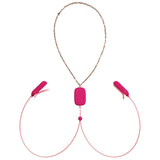 The OhMiBod Sphinx Bluetooth App-controlled Nipple Clamps in raspberry feature two vibrating clamps connected by a gold chain, with adjustable pink sliders and a central pink pad joining the cords.