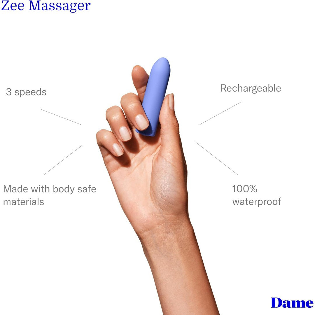 A hand holding a periwinkle Zee Bullet Portable Clitoral Vibrator by Dame. Text around the image highlights its features: "three speeds," "USB-rechargeable," "Made with body safe materials," and "100% waterproof." The product branding "Dame" is visible in the bottom right corner.