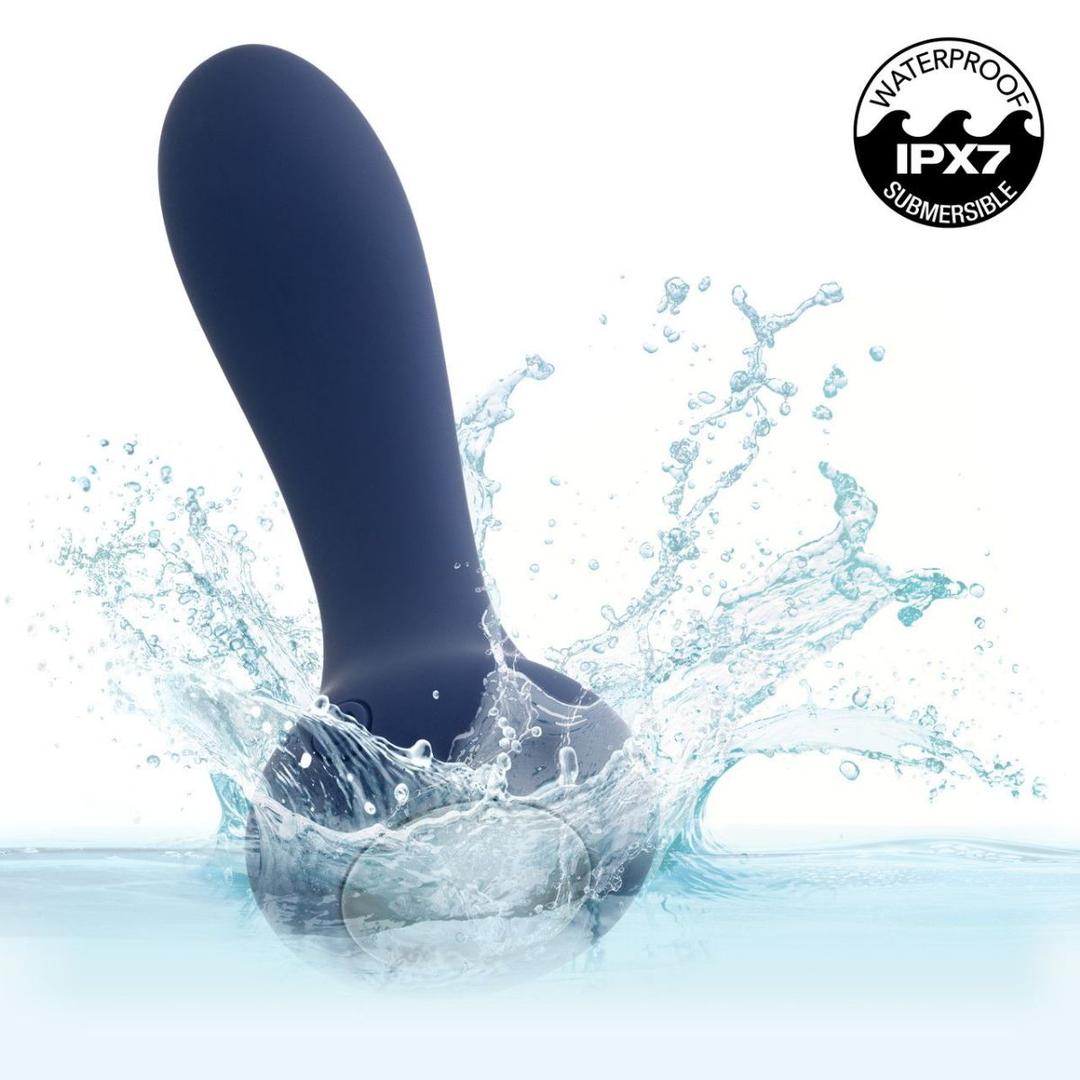The CalExotics Deep Curve Vibrating Probe, shown in dark blue, splashes into water with an "IPX7 Submersible Waterproof" label in the top right corner.