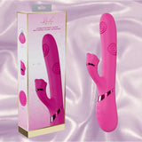 The Dolce Vive Fiore Rechargeable G-Spot Air Wave Vibrating and Tapping Clit by Shots America, featuring a curved pink silicone design with dual stimulation, is shown beside its packaging on a soft, light pink satin background.