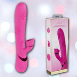 The Dolce Vive Fiore Rechargeable G-Spot Air Wave Vibrating and Tapping Clit by Shots America, in pink with a curved, textured design and stimulator, is displayed beside its detailed rectangular packaging on a softly blurred background.