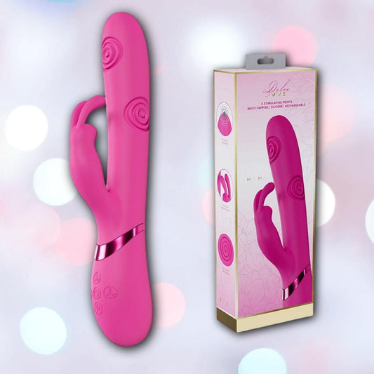 The Dolce Vive Mimi Rechargeable G-Spot Vibrating and Tapping Rabbit-Pink by Shots America, with a curved design and rabbit-shaped clitoral stimulator, is shown beside its floral-patterned packaging on a cream background. 1080