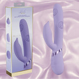 The Dolce Vive Pallina Rechargeable G-Spot Vibrating and Tapping Beads Clit by Shots America is displayed with its box, featuring a curved lavender design and textured tips, set on soft, light purple satin. The packaging showcases key features and product image.