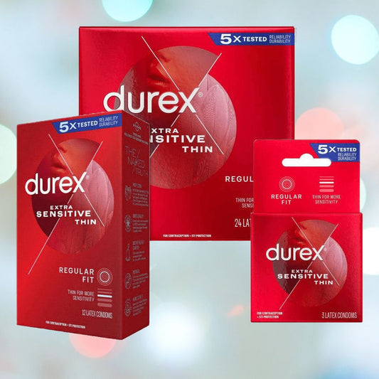 Three packages of Durex Extra Sensitive 'Thin' Condoms are displayed against a blurred background. The largest box contains 24 condoms, the medium-sized box holds 12, and the smallest pack has 3. All packaging features a red design with white and blue text, emphasizing increased sensitivity and extra lubrication. 1080