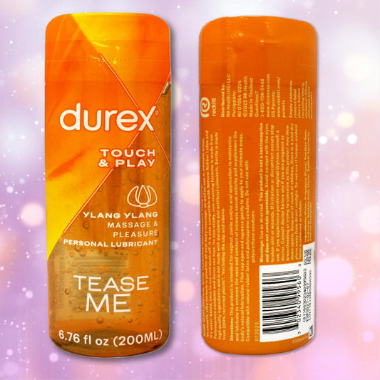 Two orange bottles of Durex Touch & Play Personal Lubricant with Ylang Ylang are displayed—one showing the front label and one showing the back label—against a vibrant purple bokeh background. 1080