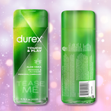 Two green bottles of Durex Touch & Play Personal Lubricant with Aloe are displayed against a soft pink background with gentle bokeh effects, one showing the front and the other the back. The label spotlights the soothing benefits of this aloe-infused lubricant from Durex, designed for both massage and intimate pleasure.