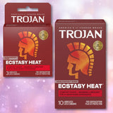 Two boxes of Trojan Double Ecstasy Condoms: Now Ecstasy Heat by Trojan, featuring a red design with the iconic Trojan helmet logo and labeled with warming lubricant and a comfort fit for enhanced pleasure, provide reliable contraception and STI protection. The packages are set against a soft pink and purple background that evokes a sense of passion.