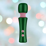 Introducing the delightful Femme Funn Bougie Wand Massager - Green: a handheld massager featuring a pink flexible silicone neck and pink power buttons on its body. The background presents a soft focus with variously colored light bokeh, creating a festive ambiance. Made by Femme Funn, this product combines functionality with an eye-catching design.