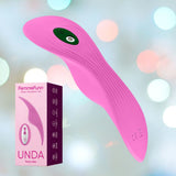 A FemmeFunn Unda Panty Vibrator in Pink is shown in the foreground against a blurred background with circular light spots. The product features an ergonomic design with a ribbed texture and a control button. Its box is next to it, showcasing the product image and brand information, highlighting its Boost Mode.