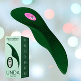 The image showcases a dark green FemmeFunn Unda Panty Vibrator from Femme Funn, featuring a sleek, ribbed design and a pink control button. The item is depicted alongside its packaging, adorned with product illustrations and branding text against a bokeh background. This discreet pleasure device also features an exciting Boost Mode for enhanced sensations.