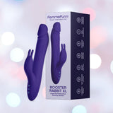 The Femme Funn Booster Rabbit XL: Deluxe Rotating Vibrator with Boost Mode in dark purple, featuring a rabbit-shaped clitoral stimulator, is shown next to its box against a soft pastel-lit background.