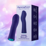A dark purple Femme Funn Hana Thumping Bullet vibrator made from SOFTFEEL silicone sits by its box, which highlights its waterproof, rechargeable, and quiet features on a pastel bokeh background.