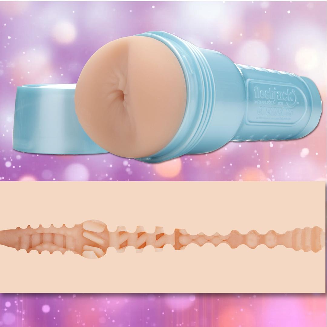 A Fleshjack Boys Allen King: Realistic Male Masturbator Majestic Cake Butt by Fleshlight in light blue, shown uncapped to reveal a lifelike orifice and cross-sectional textured sleeve, set against blurred pink and purple lights.