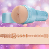 A Fleshjack Boys Allen King: Realistic Male Masturbator Majestic Cake Butt by Fleshlight in light blue, shown uncapped to reveal a lifelike orifice and cross-sectional textured sleeve, set against blurred pink and purple lights.